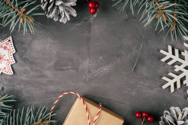 istock Background image. Frame made of Christmas decorations on gray uneven concrete surface. Top view. Copy space 1352136967