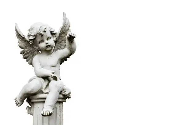 Photo of cherub statuette isolated on white. white background