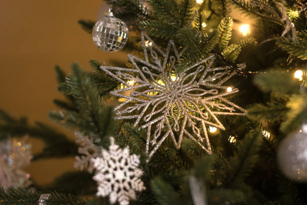 istock Christmas tree decorated with white and silver Christmas decorations, close-up.New Year's background. 1352139102