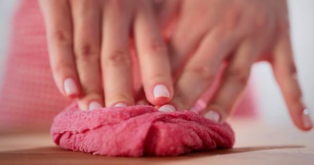 istock focus on a woman who is working a pink pasta 1352141028