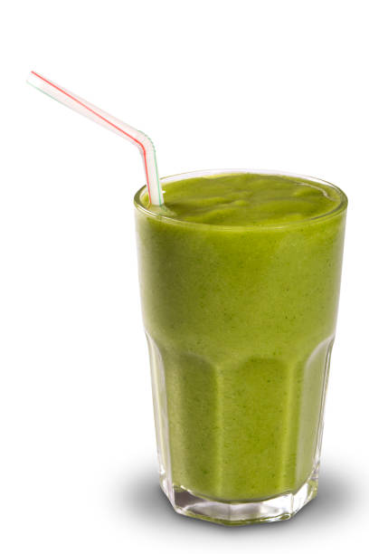 istock Green smoothie in a glass with straws isolated on a white background 1352145677