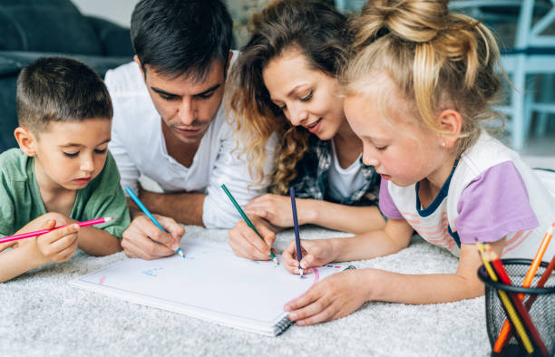 istock Family drawing on floor at home 1352146509