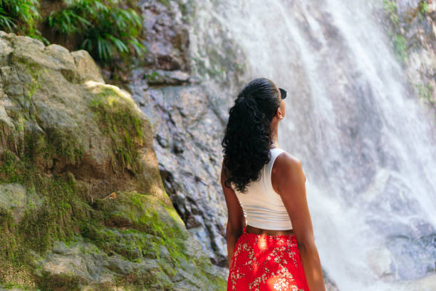 istock Latin Woman Exploring Tropical Forest 1352150489