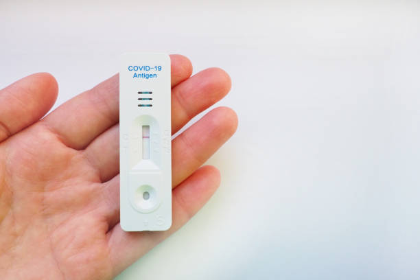 istock The test result for COVID-19 is negative, not infected, using rapid testing equipment. Test for coronavirus on the hand, white background. Copy space. Testing Concept Coronavirus Disease infection. 1352151252