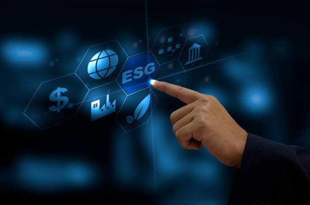 Environmental, social, and governance (ESG) investment Organizational growth. Business man hand touching the ESG word  icon on a virtual screen stock photo