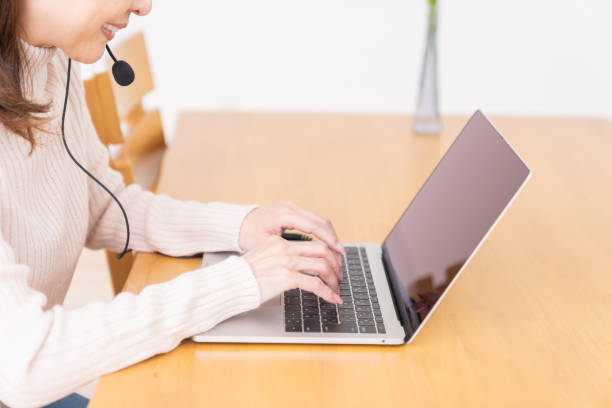 istock senior age woman studying with a laptop,hands,correspondence course 1352153885