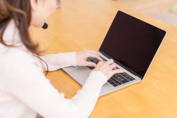 istock senior age woman studying with a laptop,hands,correspondence course 1352153989