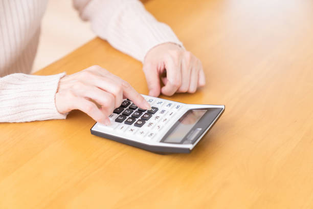 istock senior age woman having an electronic calculator 1352154514