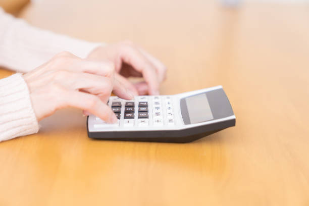 istock senior age woman having an electronic calculator 1352154554
