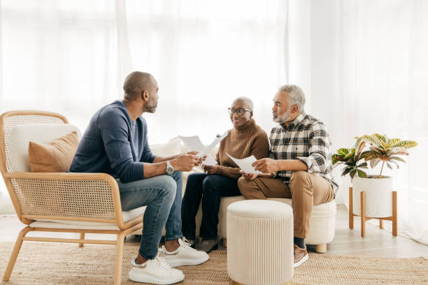 istock Real Estate Agent visiting senior couple at home 1352163253