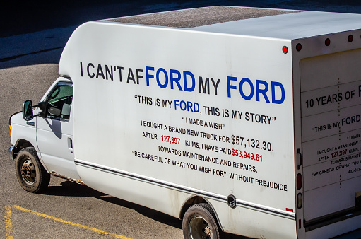 Calgary, Alberta, Canada, October 24, 2021: a Ford truck in a parking lot close to downtown with a frustrated message on it.