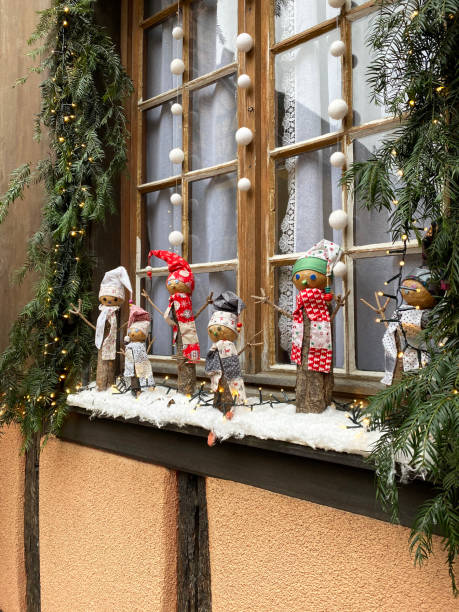 istock Stylish Christmas decorations on window sill 1352165412
