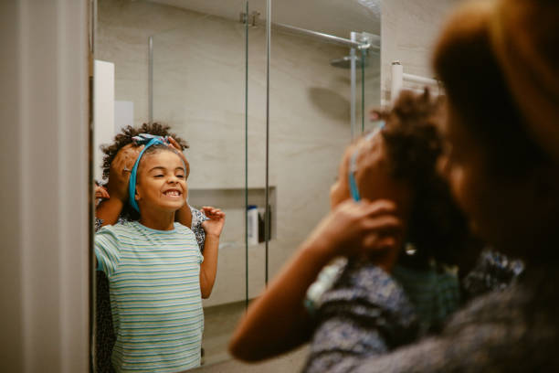 istock Young girl getting ready for bed with her mom 1352165661