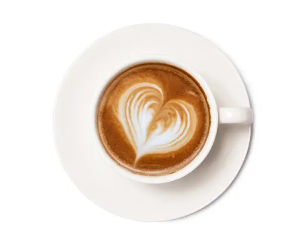 Photo of Coffee cup of art latte with froth heart shaped  isolated on white background. with clipping path.