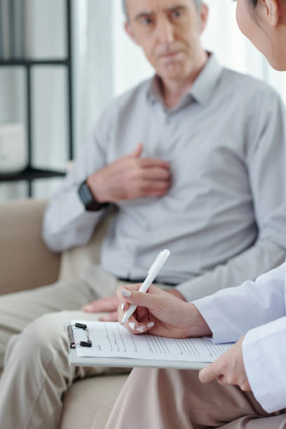 istock General Practitioner Filling Medical Card 1352168913