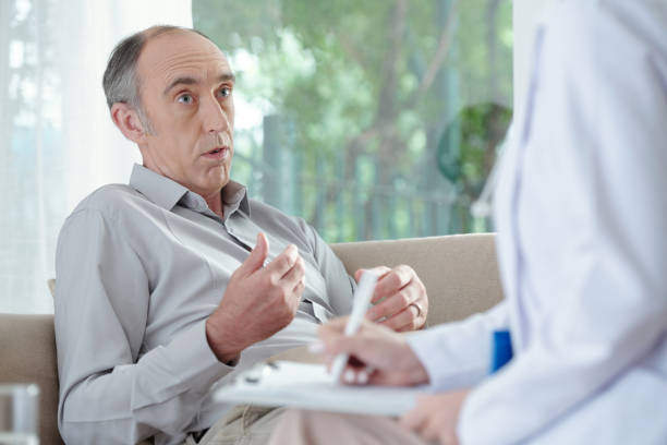 istock Senior Man Talking to Doctor 1352168936