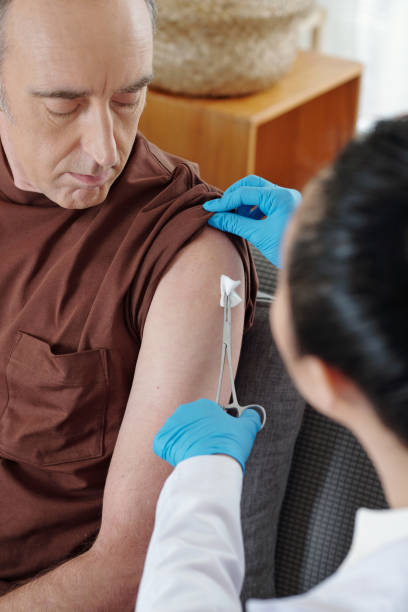 istock Doctor Cleaning Vaccine Site 1352168980