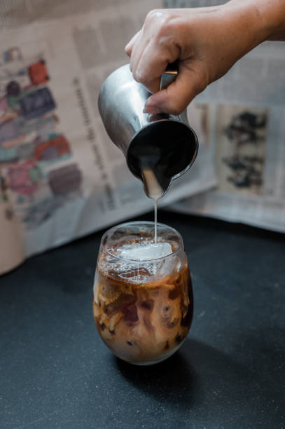 istock Glass of coffee on the table 1352169863