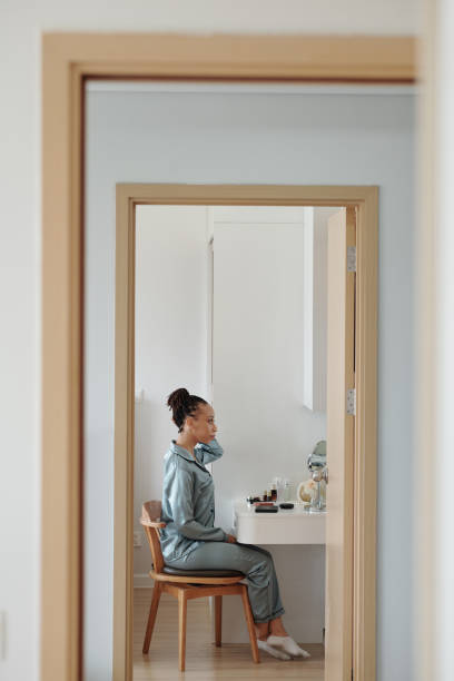 istock Woman Sitting at Vanity 1352172884