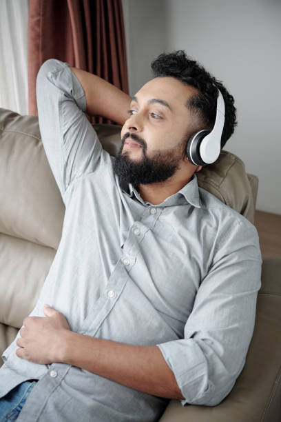 istock Man Enjoying Good Music 1352172916