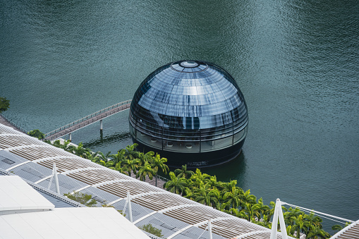 Singapore, September 10, 2020: Apple opened the worlds first floating Apple Store at the Marina Bay in Singapore at the time of this shoot. After a few days it has already become a Singapore landmark. Here the sphere shaped store seen at daylight.