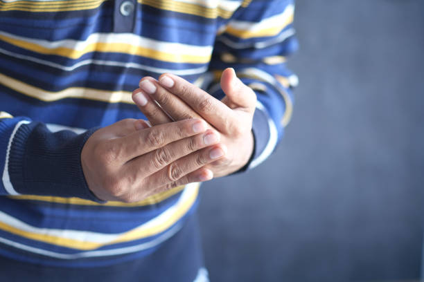 istock man suffering pain in hand close up 1352175838