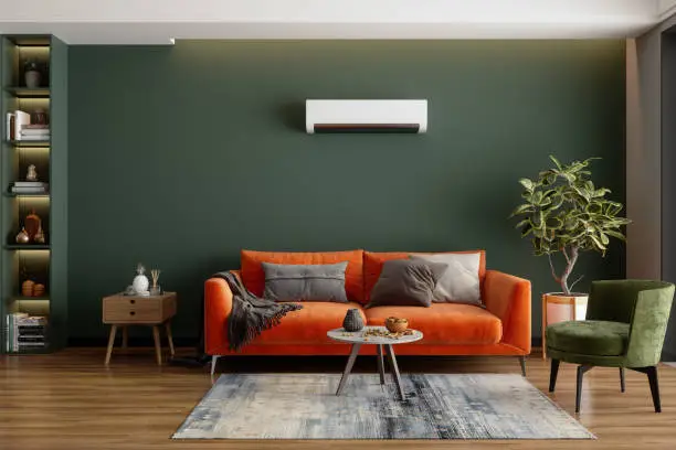 Photo of Modern Living Room Interior With Air Conditioner, Orange Sofa And Green Armchair