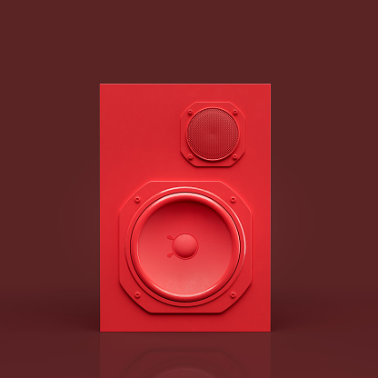 Red color professional speakers on the floor in a red background, front view, 3d rendering, sound monitoring