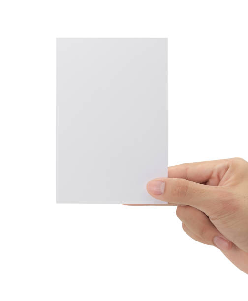 istock Hand holding blank paper isolated on white background with clipping path, Greeting card mockup 1352181732