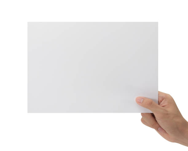 istock Hand holding blank paper isolated on white background with clipping path, Poster Mockup 1352181737