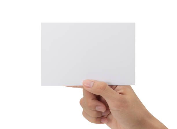 istock Hand holding blank paper isolated on white background with clipping path, Greeting card mockup 1352181738