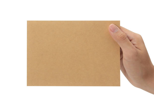 istock Hand holding blank cardboard paper isolated on white background with clipping path, Greeting card mockup 1352181743