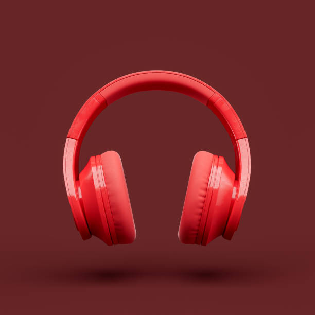 istock Monochrome red color over ear headphone in a red studio, front view, 3d rendering 1352182482