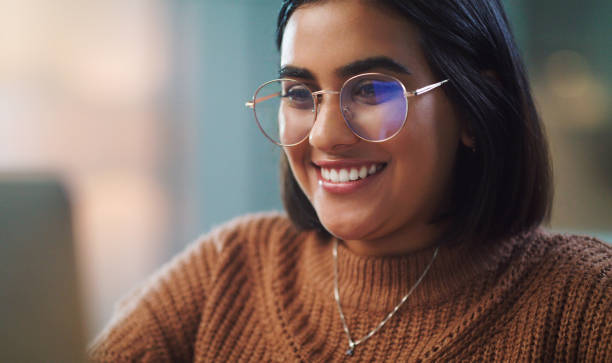 istock Shot of a young woman using a laptop while studying at home 1352185857
