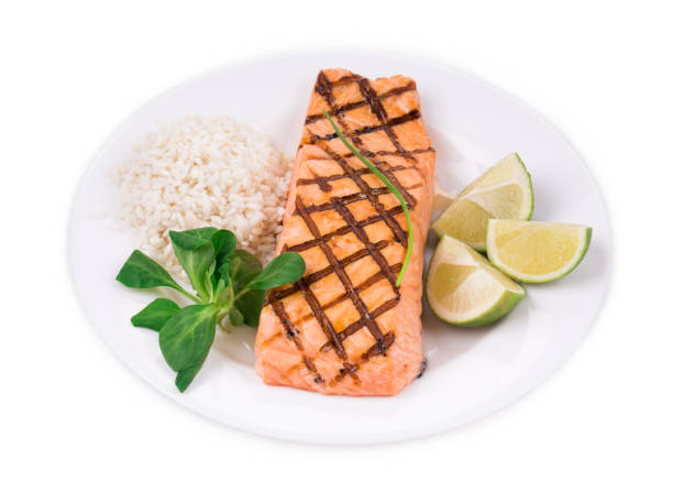 istock Fried salmon fillet with rice. 1352186096