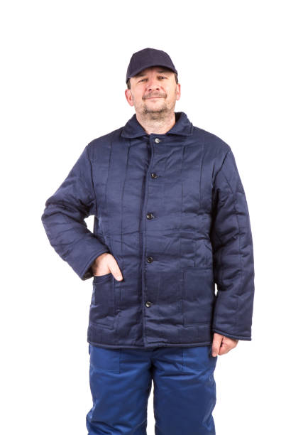 istock A worker in winter overalls holds his hand in his pocket. 1352186207