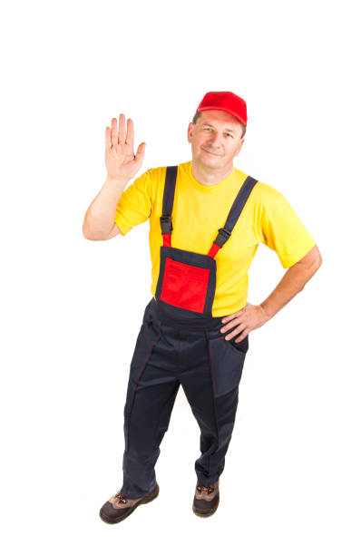 istock The worker raised his hand in greeting. 1352186227