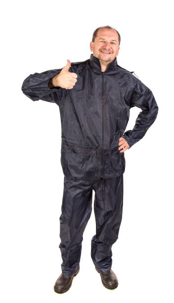 istock A worker in a black waterproof overalls shows a thumb up. 1352186251