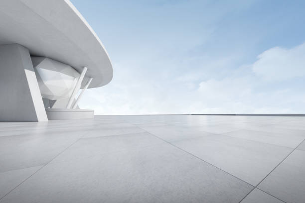 istock 3d render of futuristic architecture with empty concrete car park. 1352187038