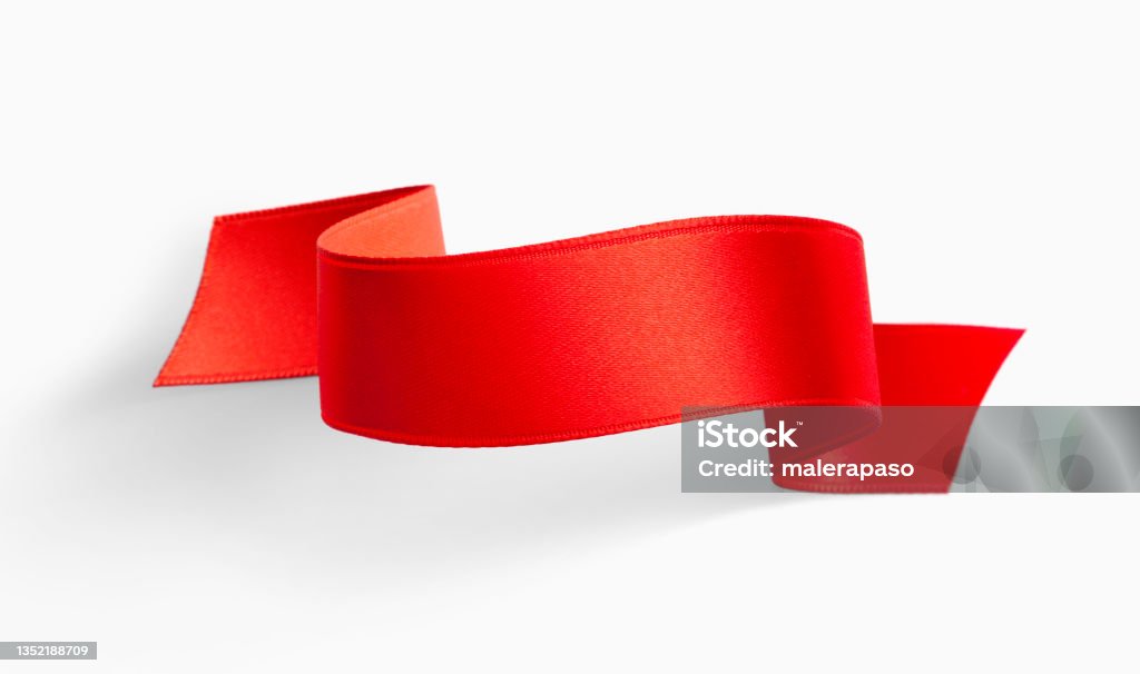 Red silk ribbon Red ribbon banner isolated on white background. Ribbon - Sewing Item Stock Photo