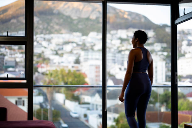 istock Woman taking a break from exercise to look at the view 1352188986