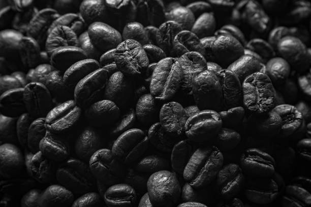 istock Black and white roasted coffee beans 1352189739