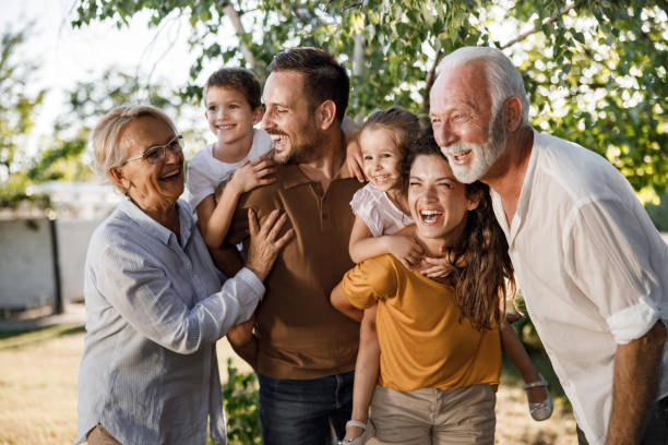 istock Cheerful extended family having fun in nature. 1352194605