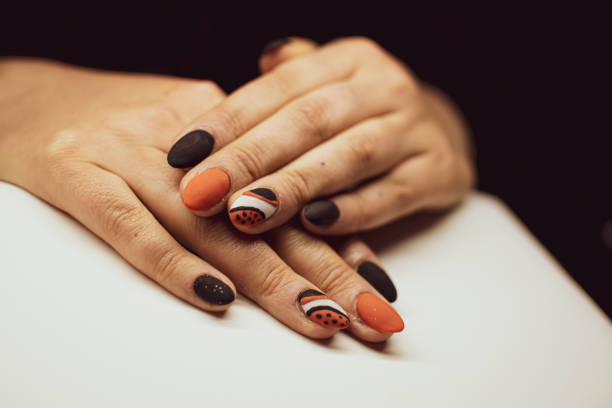 istock Terrible nail design on female hands 1352194646