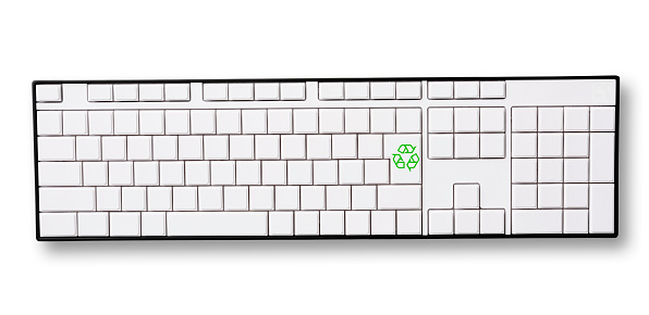 Close-up of blank computer keyboard with green recycling symbol enter key, isolated on white with clipping path.\nRecycling concepts.