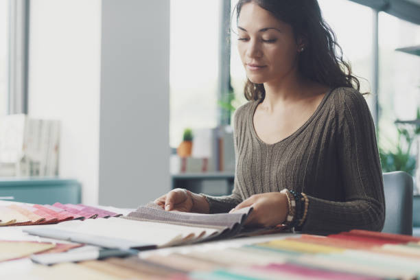 istock Creative designer picking fabric swatches 1352194674