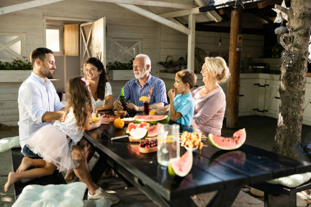 istock Happy extended family having a picnic on a patio. 1352194708