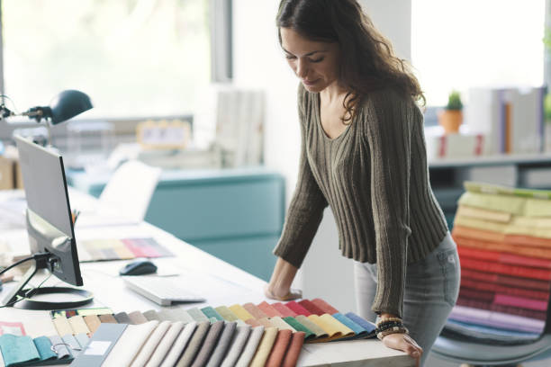 istock Professional decorator choosing fabric swatches 1352194828