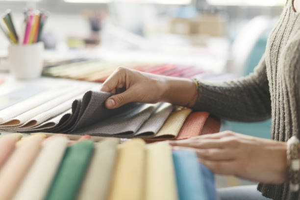 istock Professional decorator picking fabric swatches 1352195404