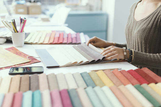 istock Professional decorator picking fabric swatches 1352195926